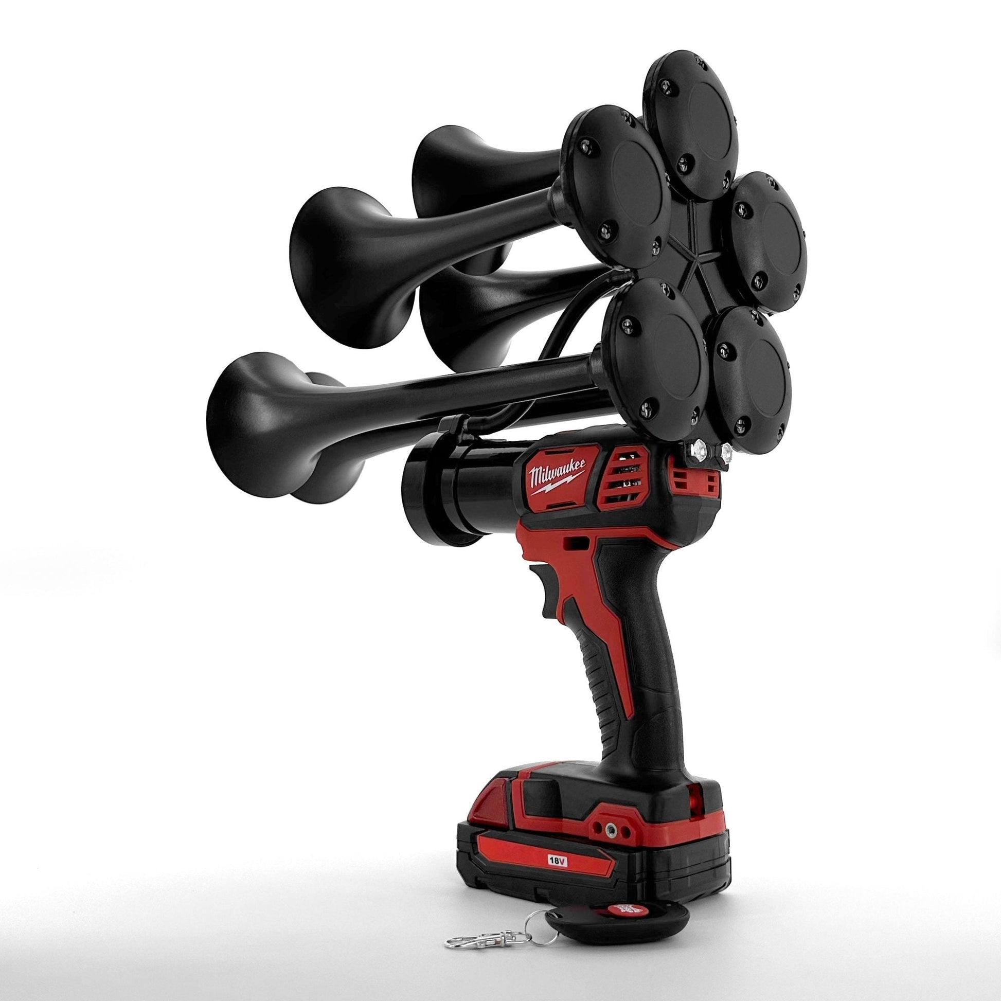 Black and red cordless drill with multiple nozzles on a white background