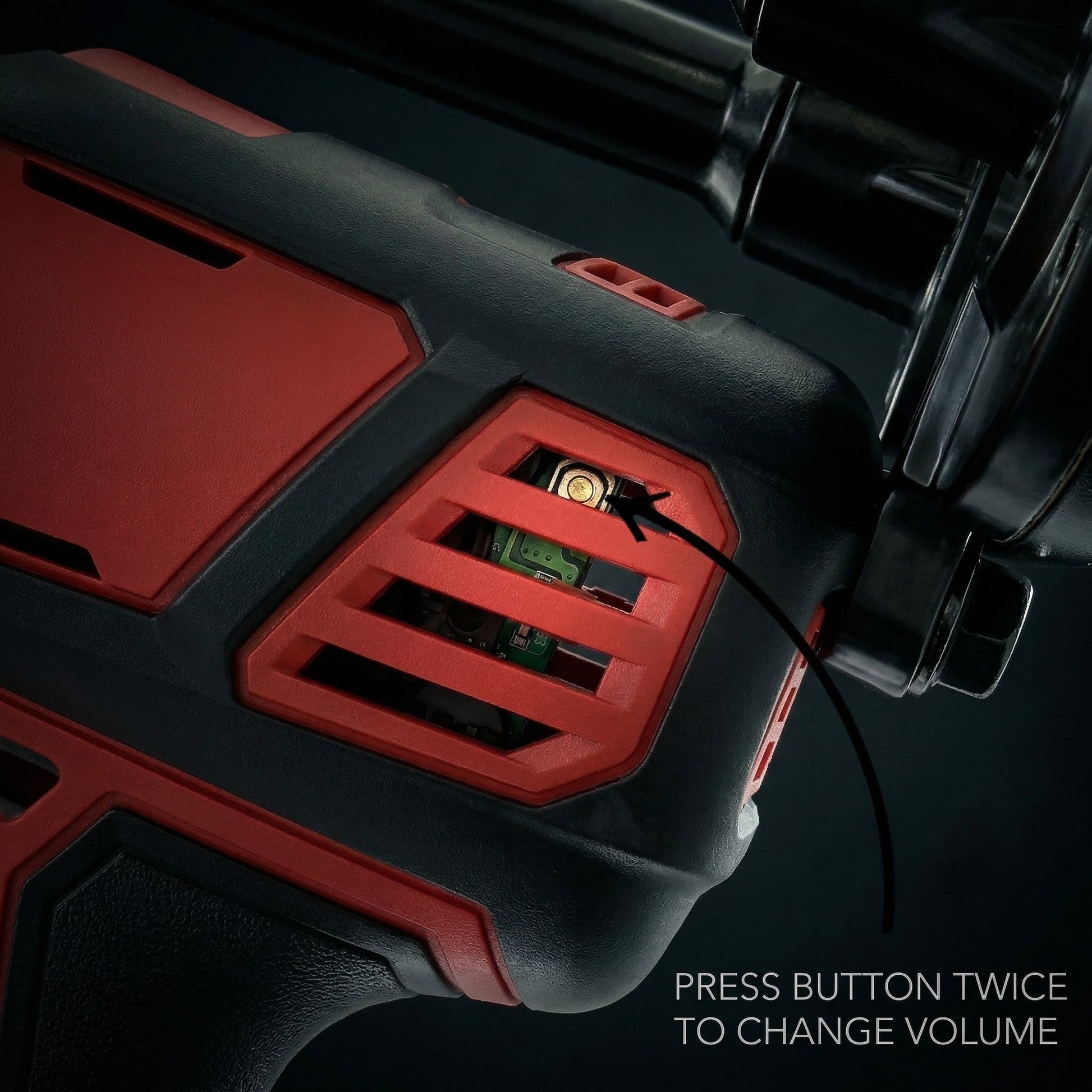 Close-up of the horn's vented housing showing the volume button with caption to press twice to change volume levels