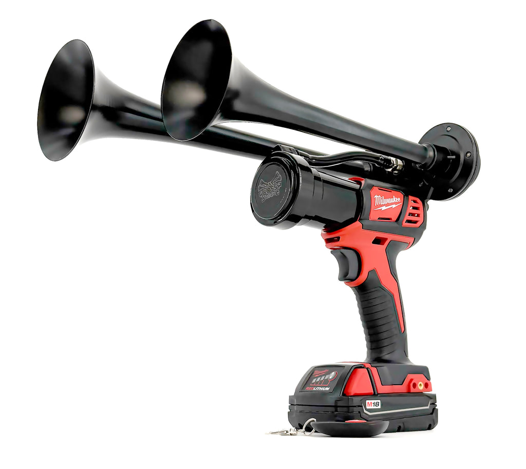 Black and red cordless drill with attachments on a white background