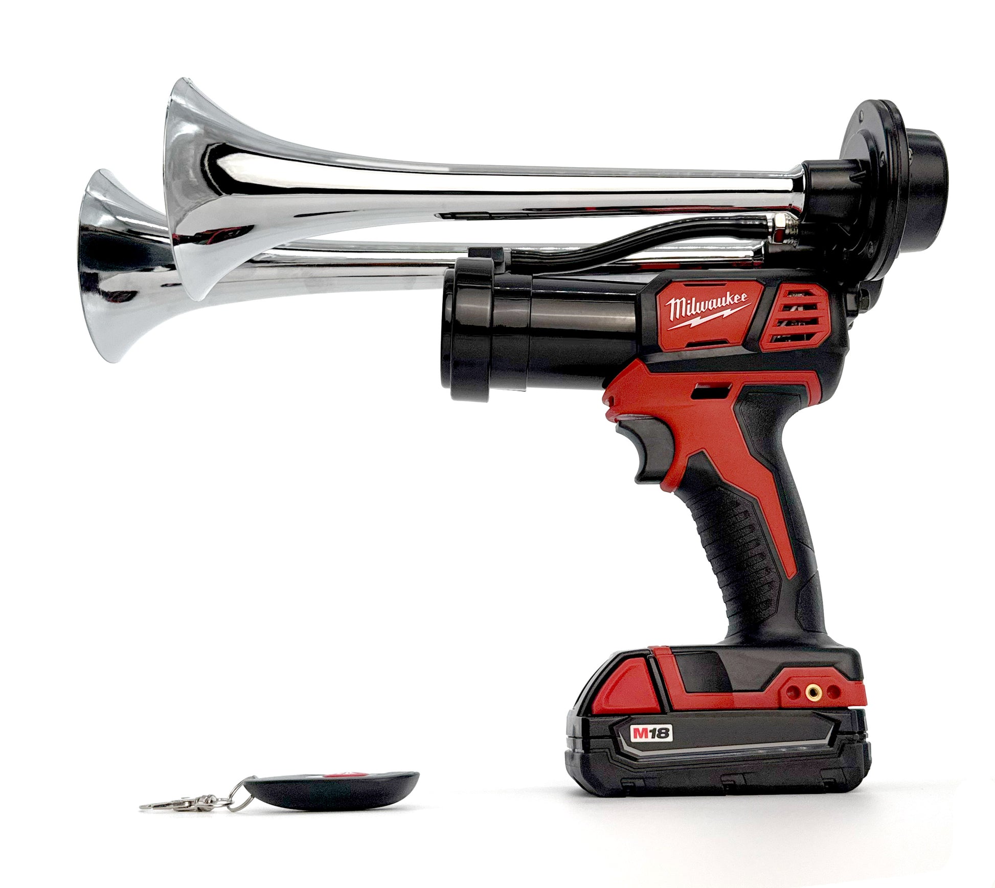Milwaukee cordless drill with chrome air horn attachment on a white background