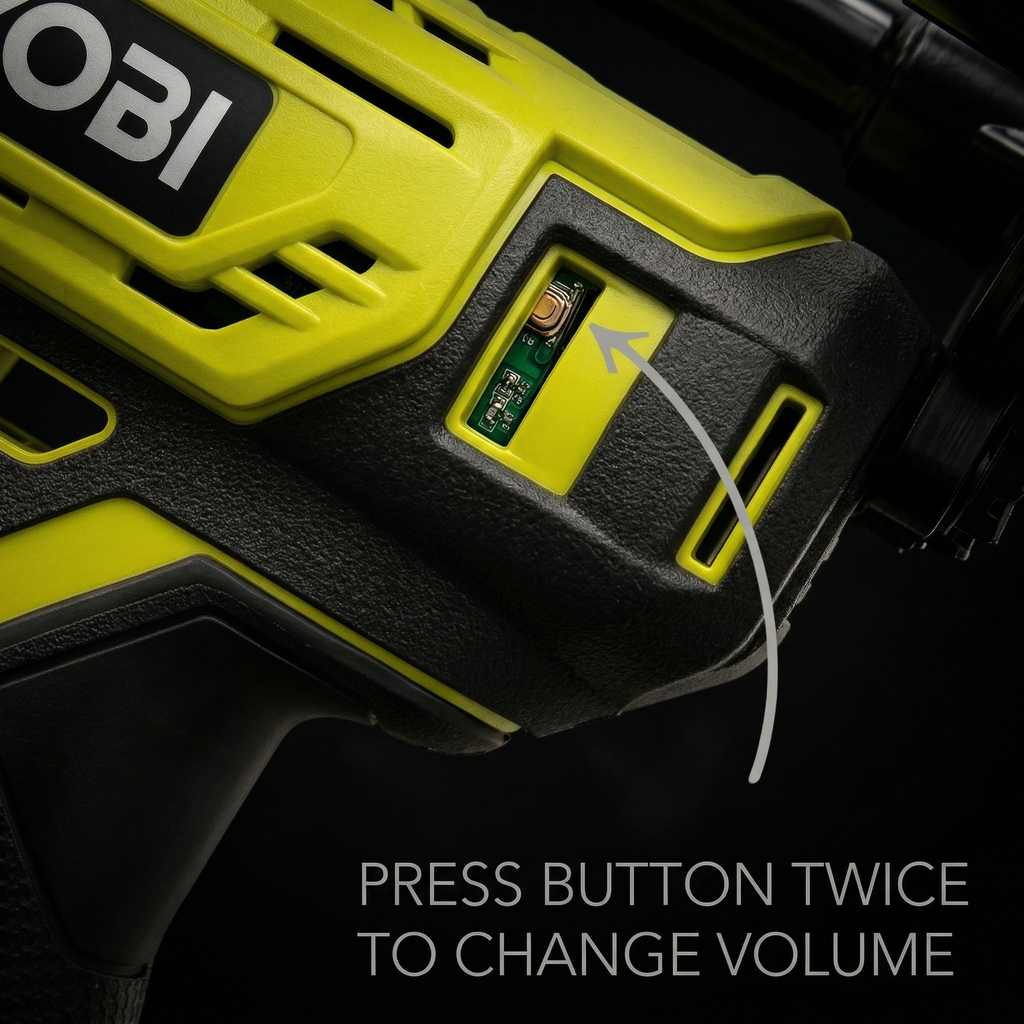 Close-up of a green and black electronic device with OBI branding and volume control instructions. dark